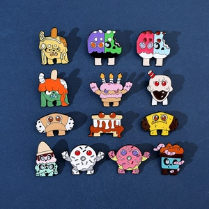 Detailed collection of 13 colorful monster dessert enamel pins on a dark background