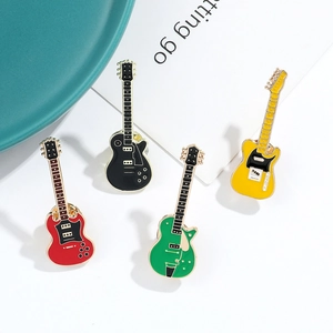 Set of four colorful guitar metal charms in black, yellow, red, and green enamel finish