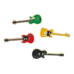 Close-up of four guitar-shaped metal charms in green, yellow, red, and black finish