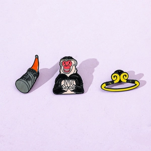 Detailed set of three Monkey King enamel pins featuring a crown and magic golden staff