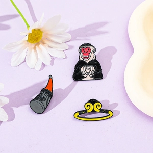 Detailed view of Sun Wukong enamel pins including a monkey, golden staff, and headband