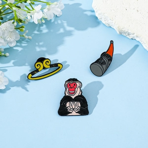 Three-piece Journey to the West enamel pin set featuring Sun Wukong and golden staff