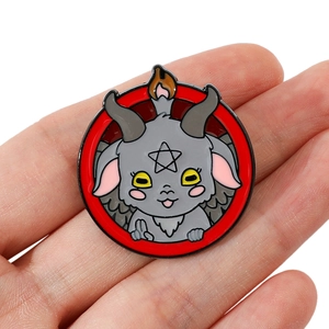 Cartoon Baphomet enamel pin with red circular border and occult pentagram symbol