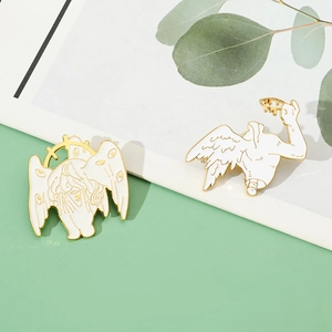 Close-up of white enamel Seraphim wings pins with gold plating and multi-eye details