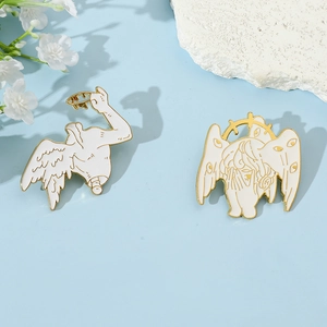 Detailed macro shot of white enamel Seraphim and classic sculpture angel brooch set