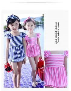 Detail of girls' striped swimsuits with ruffled shoulders and delicate lace trim accents