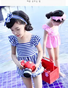 Detail of girls striped swimwear set with flutter sleeves and matching bow headbands