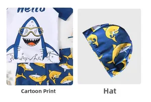 Detail of boys' shark cartoon swimsuit showing the vibrant print and matching swim cap
