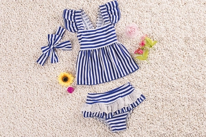 Three-piece baby girl swimwear set with navy stripes, ruffles, and lace trim details