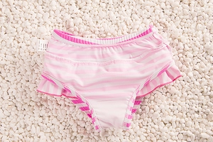 Detail of pink and white striped toddler swim bottoms with double-layered ruffles