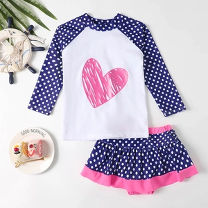 Girl's long-sleeve polka dot swimwear set with pink heart and ruffled skirt