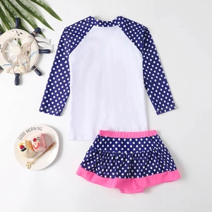 Polka dot long sleeve girls two-piece swimsuit with sun protection and ruffled skirt