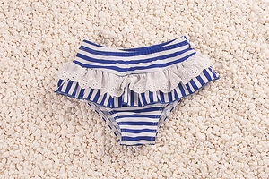 Detail of blue and white striped toddler swim bottoms with delicate white lace ruffles