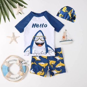 Three-piece boys shark swimsuit with short sleeves, swim trunks and matching swim cap