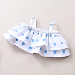 Detail of baby girls' polka dot swimsuit top with double ruffles and adjustable straps