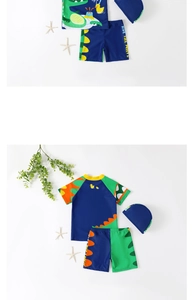 Flat lay of boys' dinosaur swim set with short sleeves, shorts, and matching sun hat