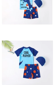 Three-piece boys' swimwear set with blue dinosaur pattern and matching swim cap detail