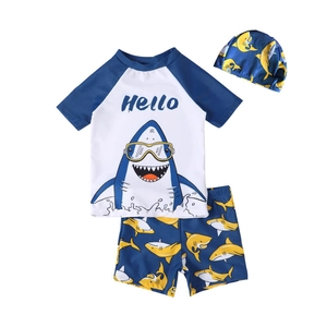 Three-piece boys shark swimsuit set with short sleeve top, trunks and matching swim cap