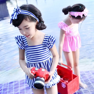 Girls navy striped ruffle swimwear set with matching bow headband for beach and pool