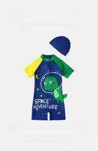 Detailed flat lay of boys quick-dry dinosaur swimsuit with matching swimming cap