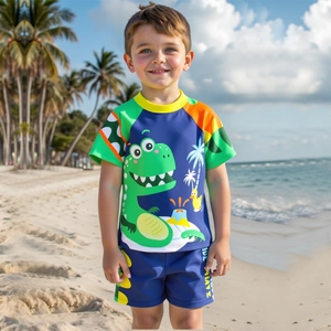 Boys two-piece quick-dry swimwear set with cartoon dinosaur print on beach background
