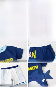 Detail view of boys' shark swimsuit with side fins, summer print, and comfortable lining