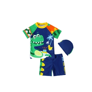 Three-piece boys dinosaur swimsuit set with short sleeve top, shorts and swim cap