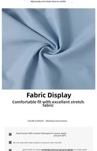 Detailed view of soft light blue stretch fabric for boys' swimwear with care instructions