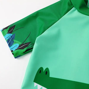 Kids quick-dry swim suit featuring cartoon crocodile print and tropical leaf sleeves