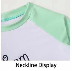Detail of the crew neck and raglan sleeves on this boys' quick-dry sun protection swimwear