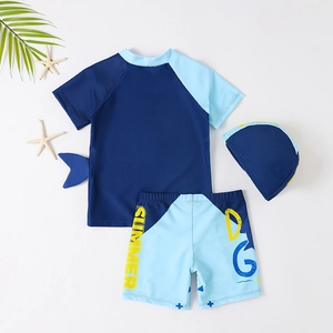Three-piece boys' shark swimwear set with short-sleeved top, shorts, and swim cap