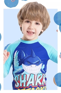 Detail of shark print on boys' long-sleeve swimwear with elastic fabric texture