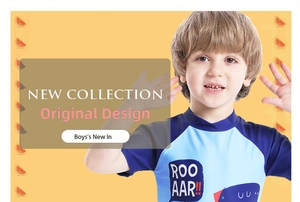 Detail of boys blue quick-dry swim shirt featuring a cartoon dinosaur print and raglan sleeves