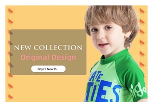 Detail of short sleeve boys' swimwear with graphic lettering and green color block design