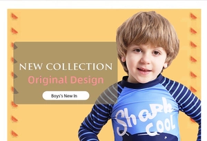 Detail of boys' shark print long-sleeve swimsuit featuring blue stripes and soft fabric