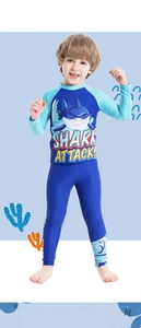 Detail of boys shark print long sleeve swimsuit with UV protection swimwear