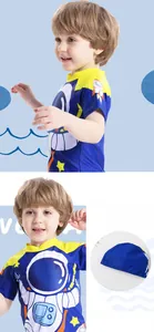 Detail of boys' sun-protective swimwear featuring astronaut prints and a matching swim cap
