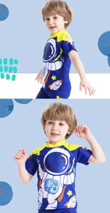 Detail of boys short sleeve swim shirt with astronaut print and sun protection fabric