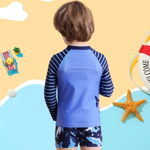 Two-piece boys long sleeve swimwear set featuring shark print and blue stripes