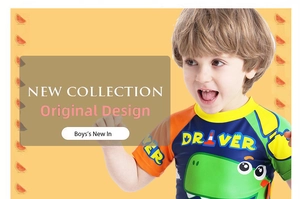 Detail of short sleeve boy's swimsuit featuring a green dinosaur and DRIVER print