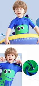 Detail of boys navy swimsuit with cartoon dinosaur print and quick-dry fabric texture