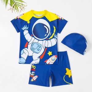 Three-piece boy's swimsuit with blue astronaut print short-sleeved top and swim cap