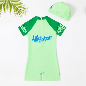 Kids one-piece alligator print swimsuit with short sleeves and matching swim cap