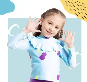 Detail of ruffle collar and cherry print on girls long sleeve sun protection swimsuit