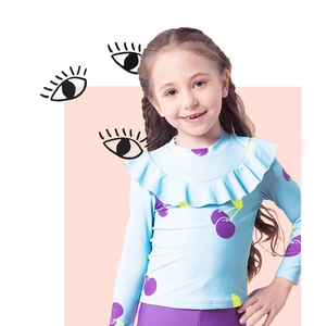Detail of girls floral sun protection swimsuit featuring ruffle neckline and long sleeves