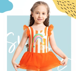 Detail of girls' orange striped swimsuit with rainbow print and layered mesh tutu skirt