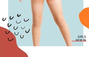 Detailed view of girls striped swimwear featuring orange hem and geometric background