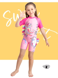 Detailed side view of pink girls swimsuit showing colorful ruffled sleeves and unicorn print