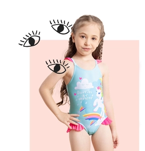 Detail of lake blue girls' unicorn swimsuit with pink ruffles and awesome slogan