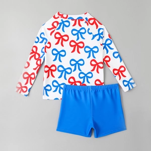 Kids long sleeve two-piece swimwear with red and blue bow prints and matching trunks